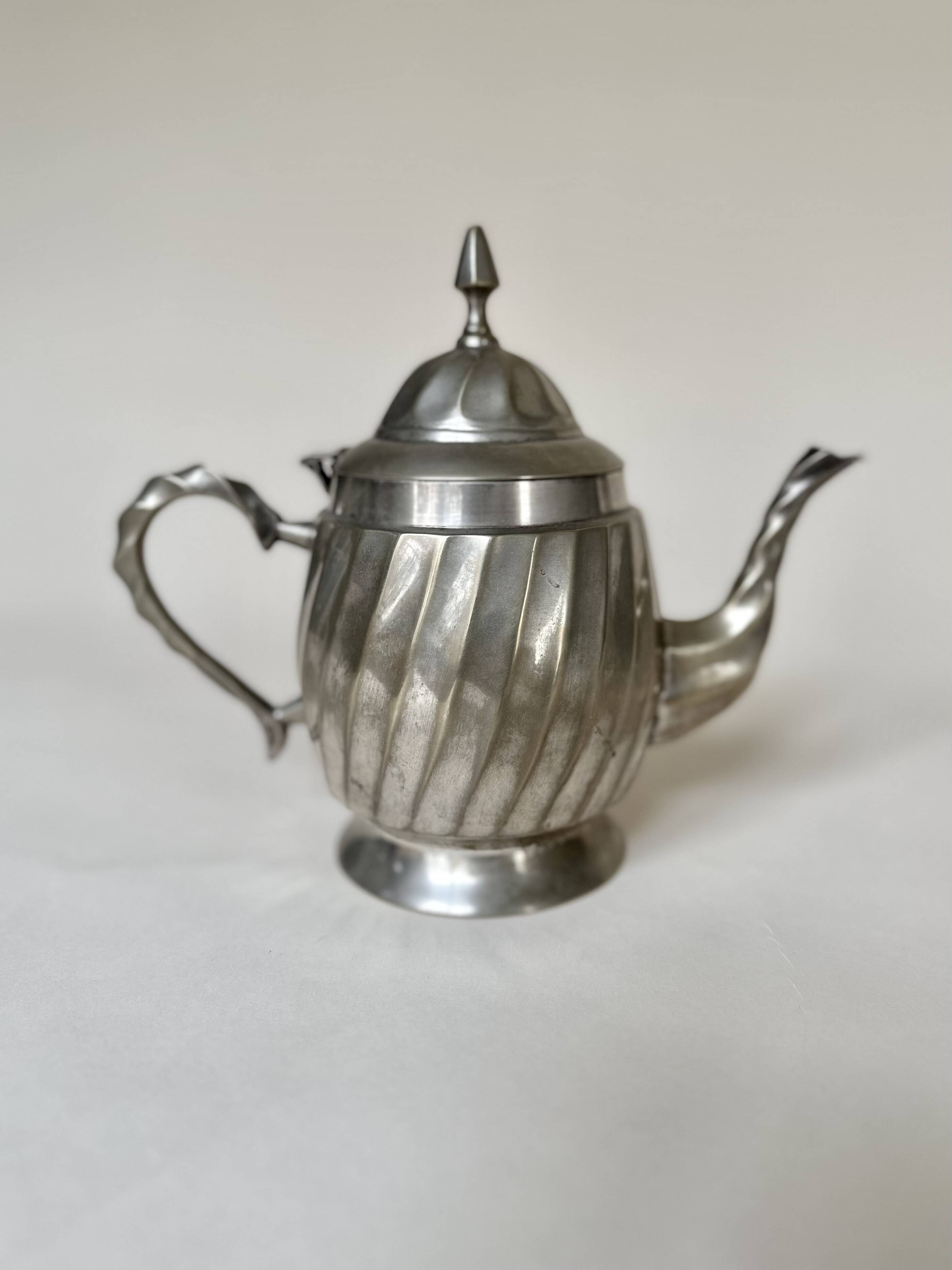 Silver-plated metal teapot with fluted body in Art Deco style