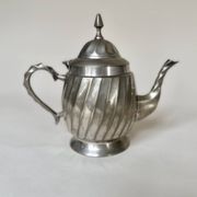 Silver-plated metal teapot with fluted body in Art Deco style