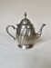 Silver-plated metal teapot with fluted body in Art Deco style