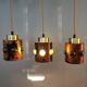 3 lamps made of copper, brass and glass.