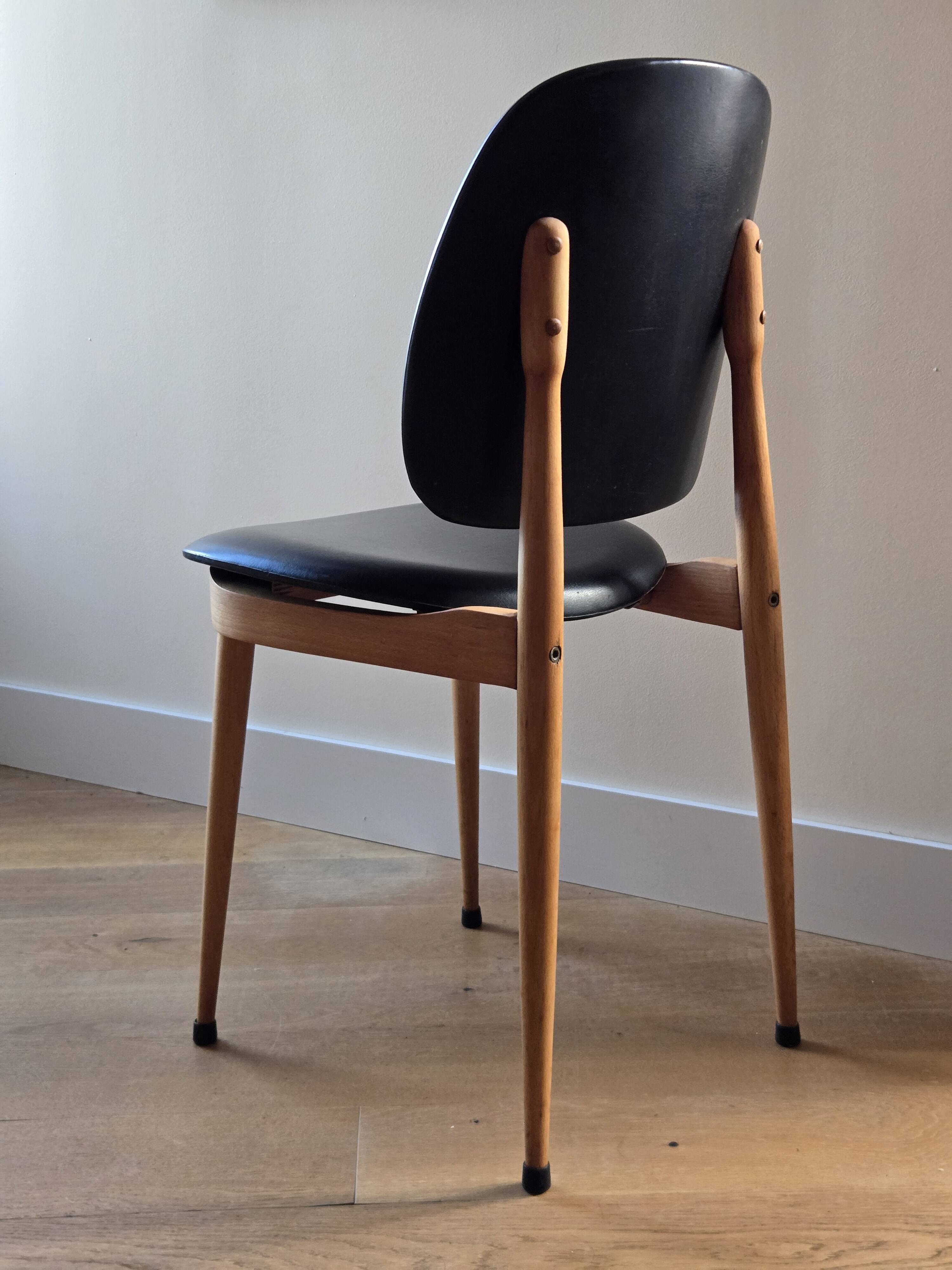 Pair of Baumann Pegasus chairs in wood and leather - design by Pierre Guariche