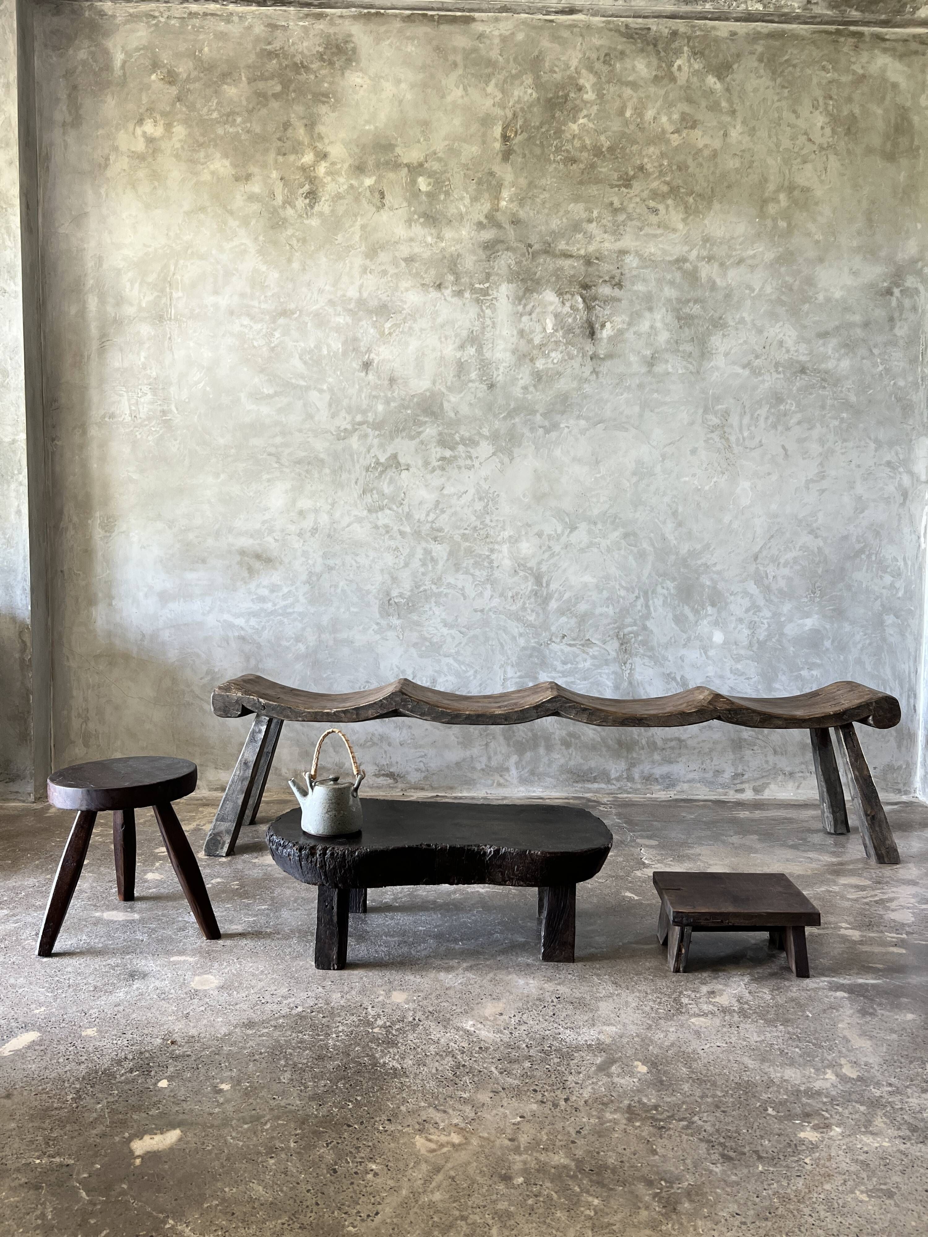 Small old Asian wooden coffee table in Japanese style, kidney-shaped top