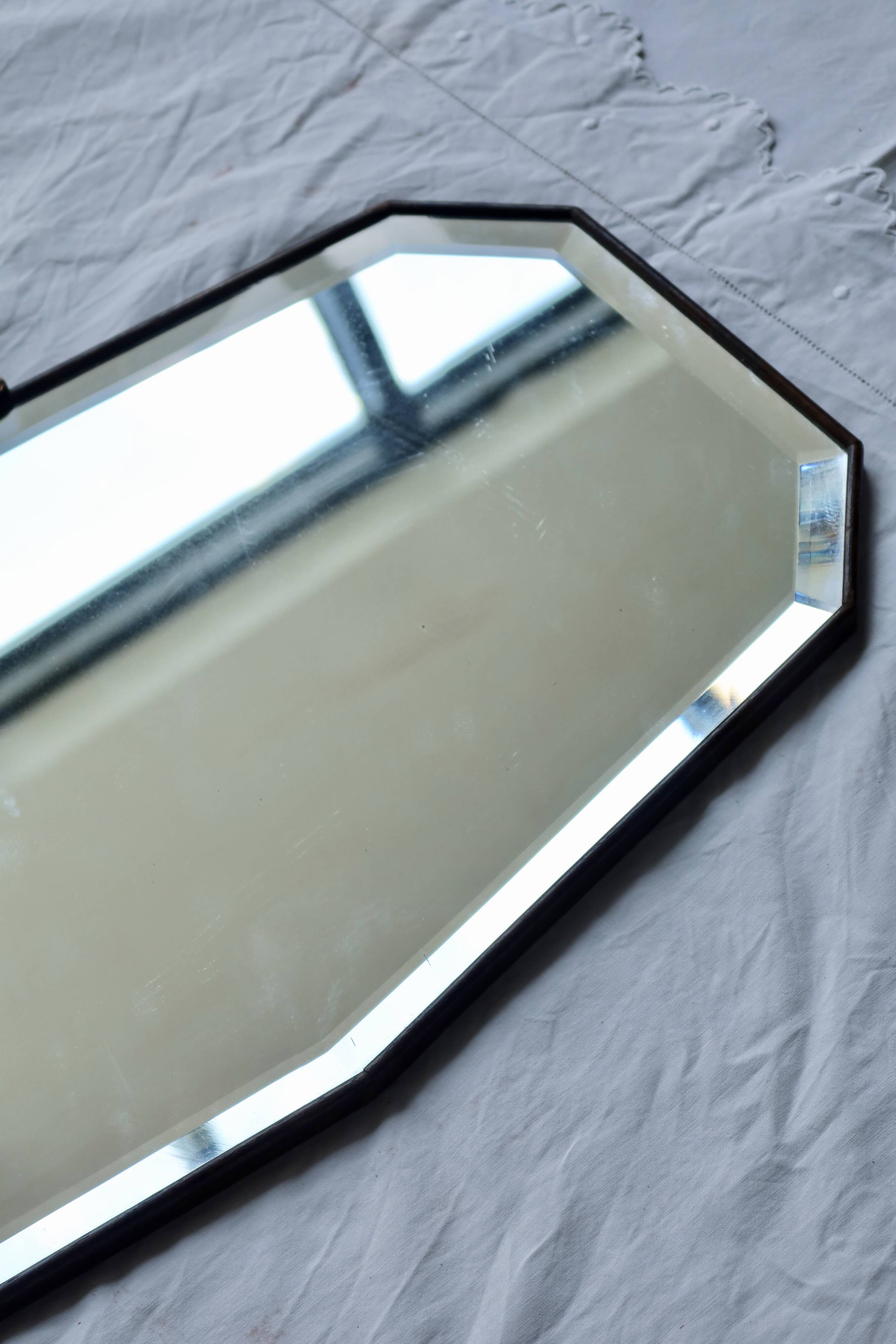 Large antique beveled mirror – dark wood and decorative bronzed metal knot
