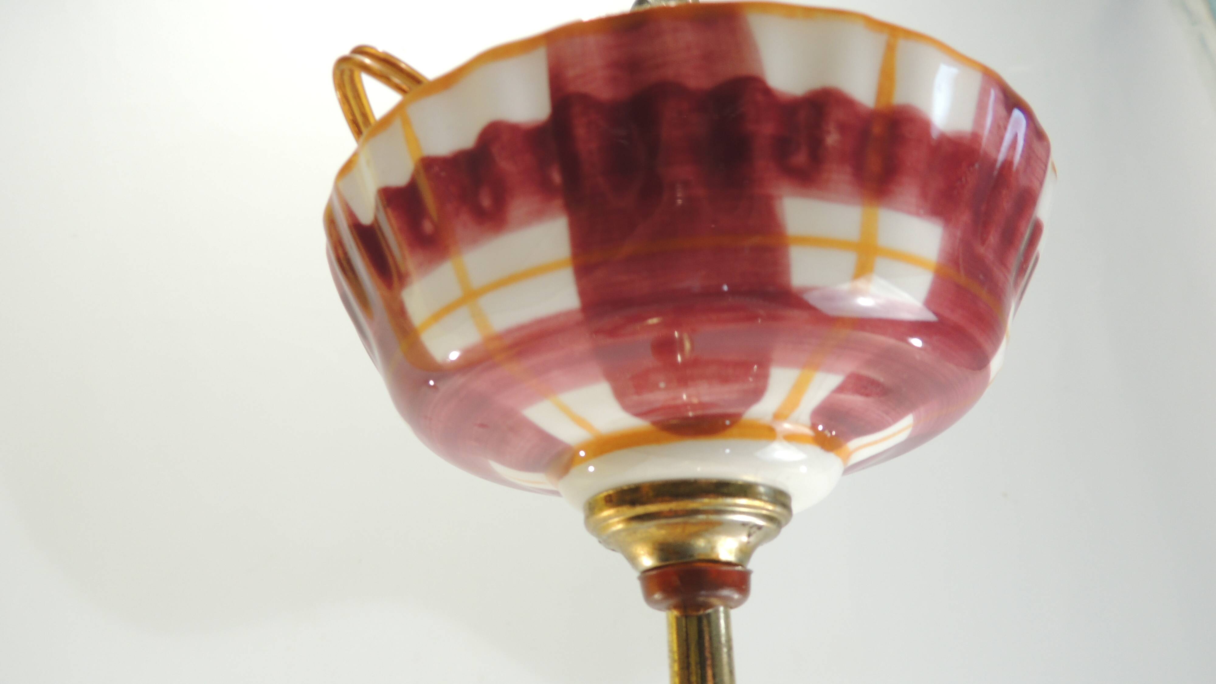 Vintage earthenware pendant light with a burgundy and ochre tartan pattern