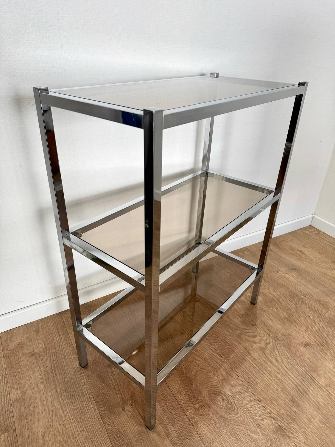 Stainless steel shelf and smoked glass