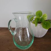 pitcher in green bubbled glass