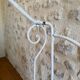 Small renovated wrought iron bed