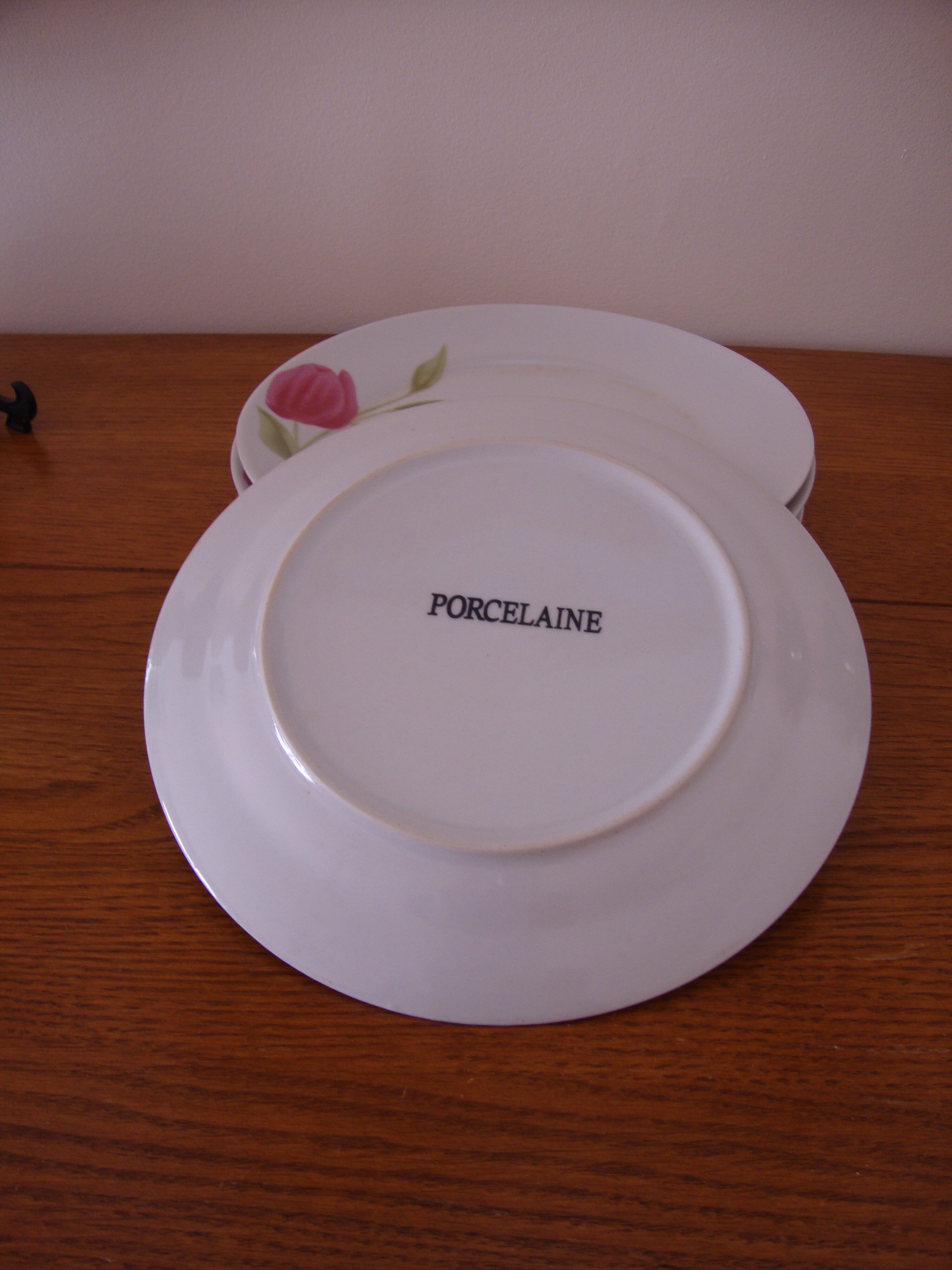 6 white porcelain dessert plates decorated with pink tulips