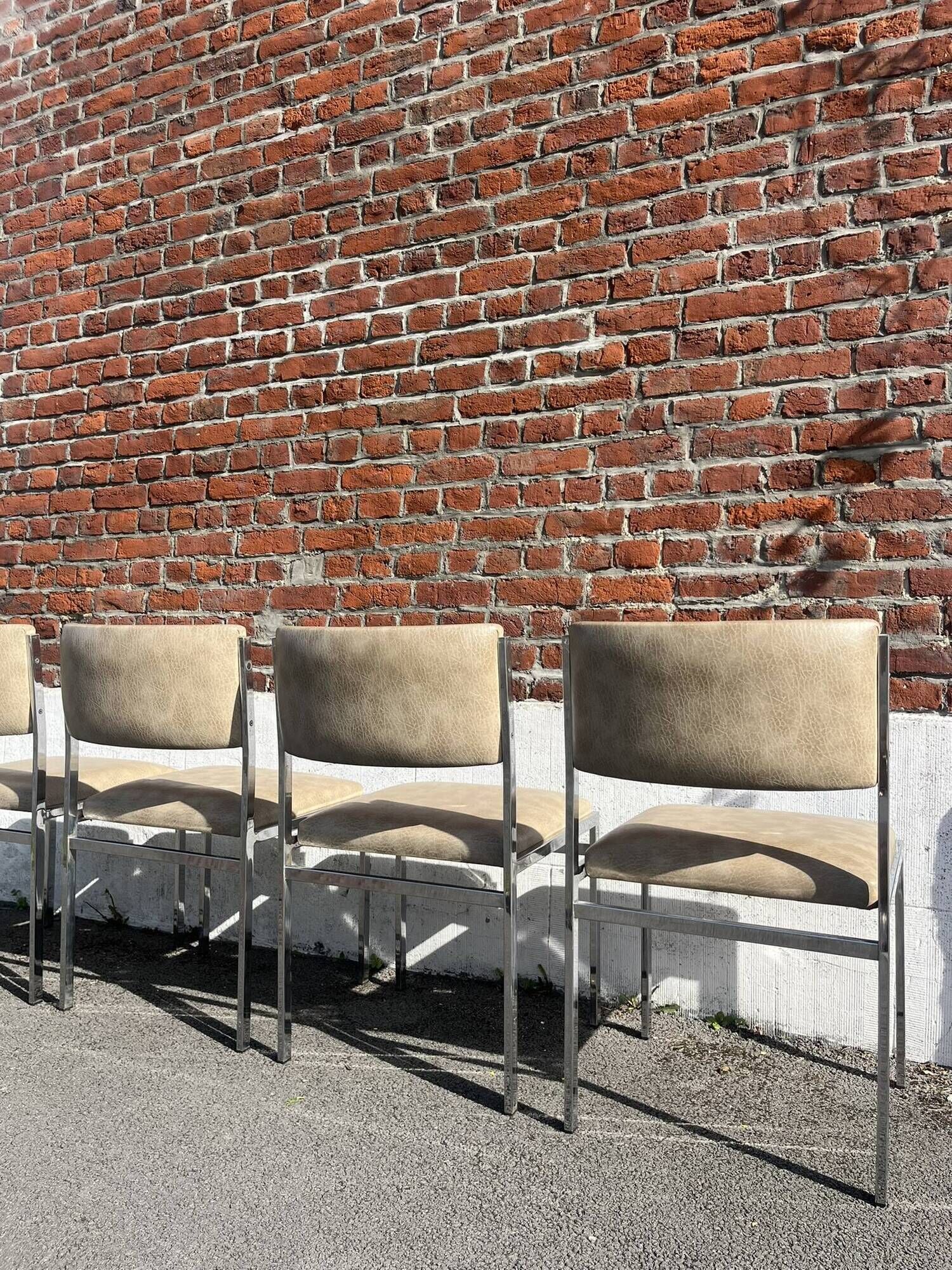 Set of 4 vintage chairs in chrome and faux leather.
