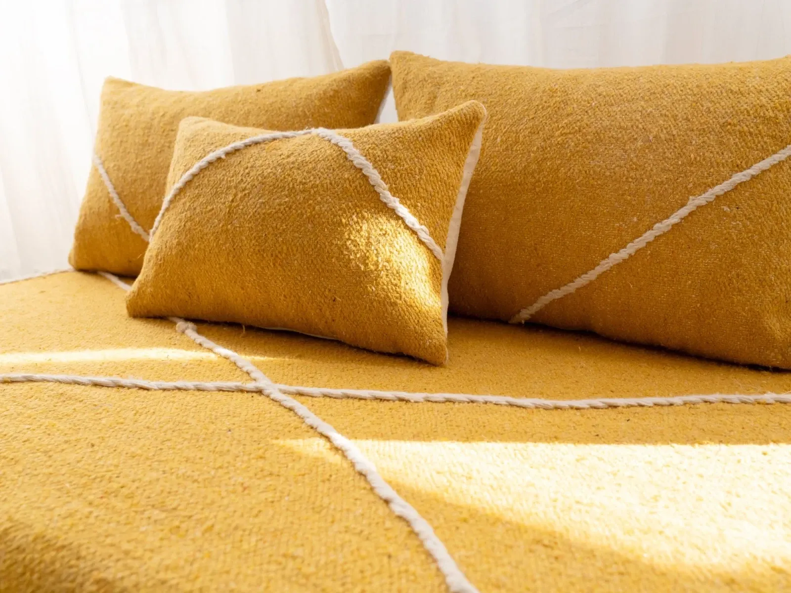 Set of yellow Moroccan floor sofa covers.