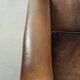 Characterful set of two sheepskin design armchairs with beautiful patina