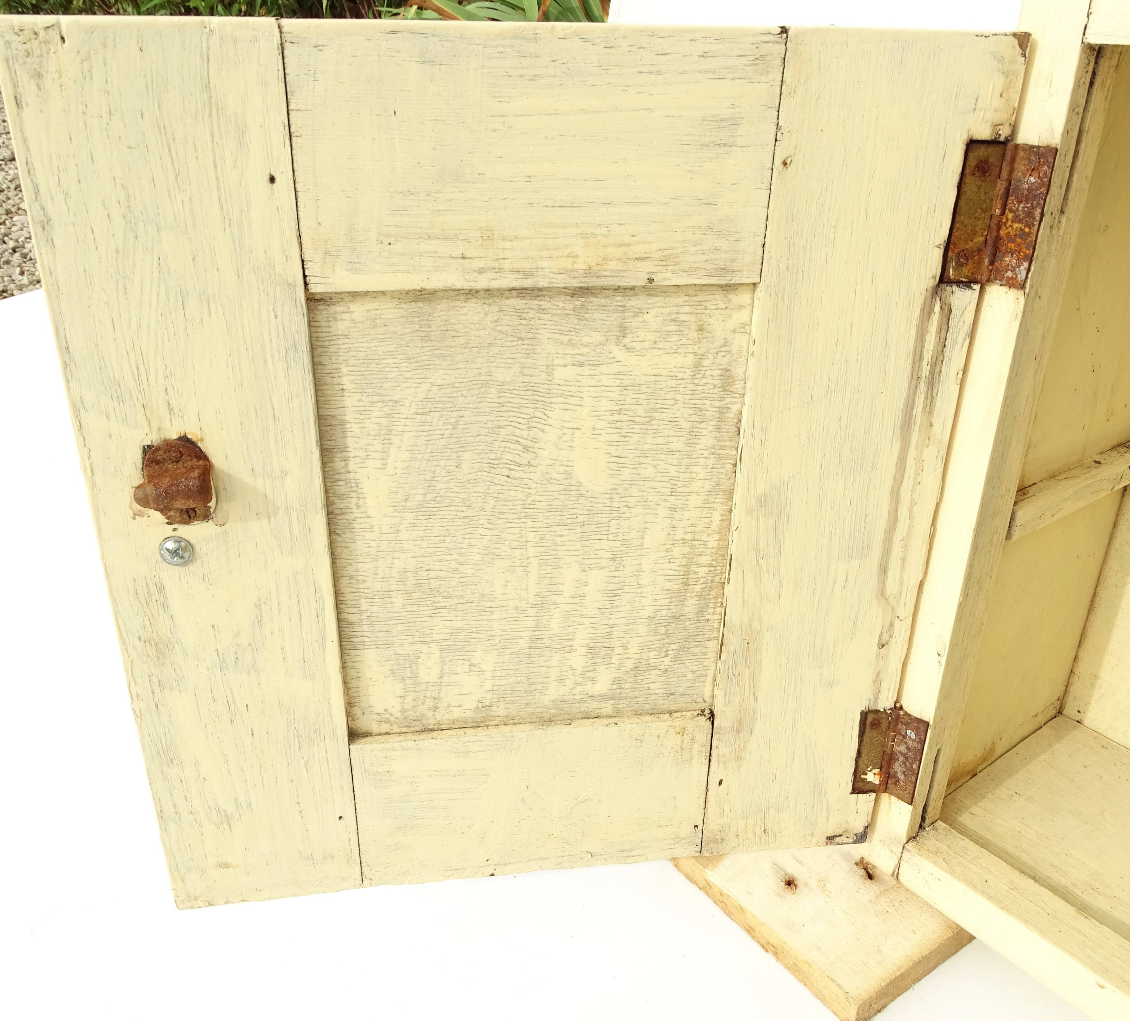 Small vintage wooden wall cupboard.