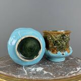 Paire de cache-pots en barbotine à décor de mascarons, XIXe siècle