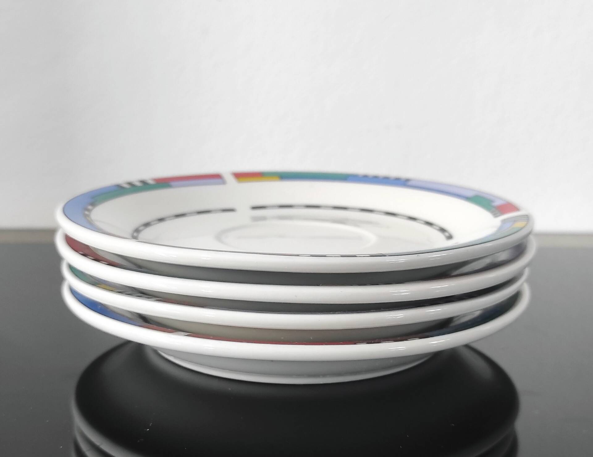 Set of small plates, vintage saucers in porcelain.