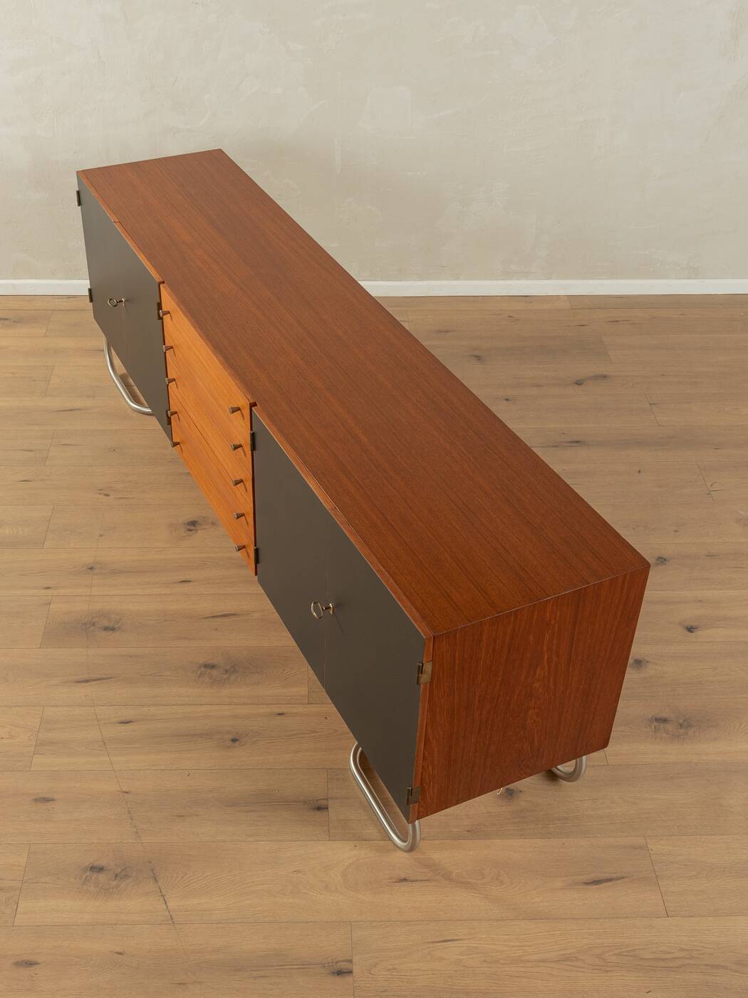 Classic sideboard from the 1960s, teak veneer, black doors, Bauhaus stainless steel feet
