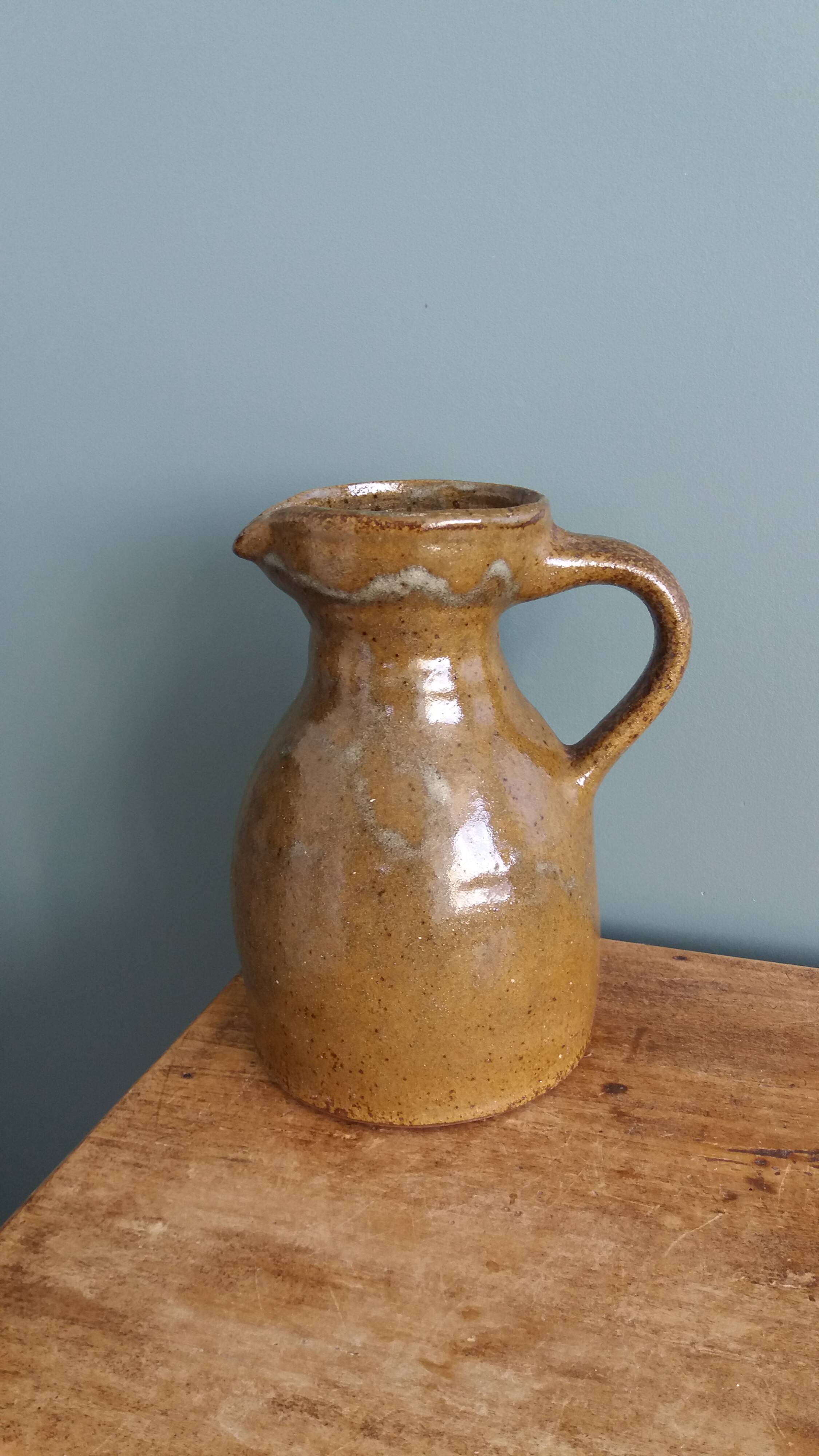 Rustic stoneware jug, chic countryside.