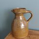 Rustic stoneware jug, chic countryside.