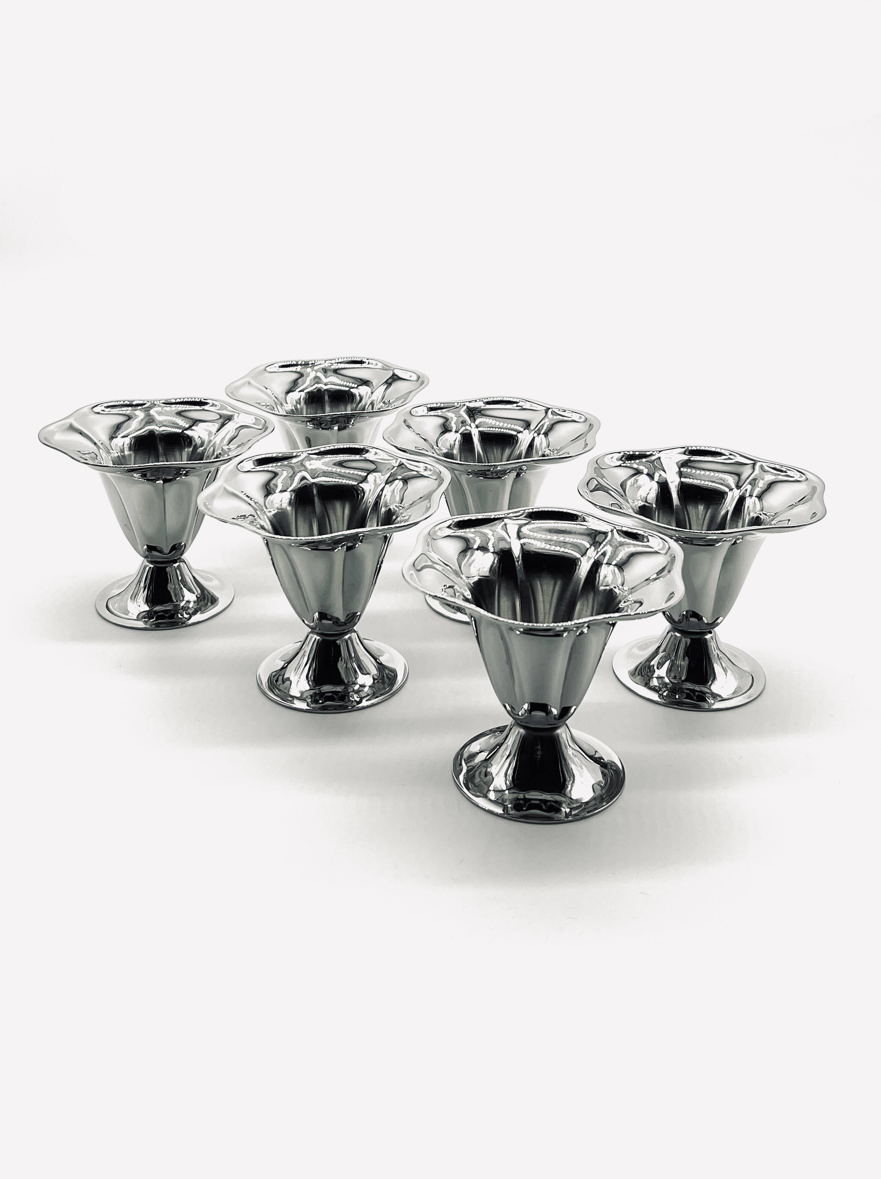 Six stainless steel dessert bowls