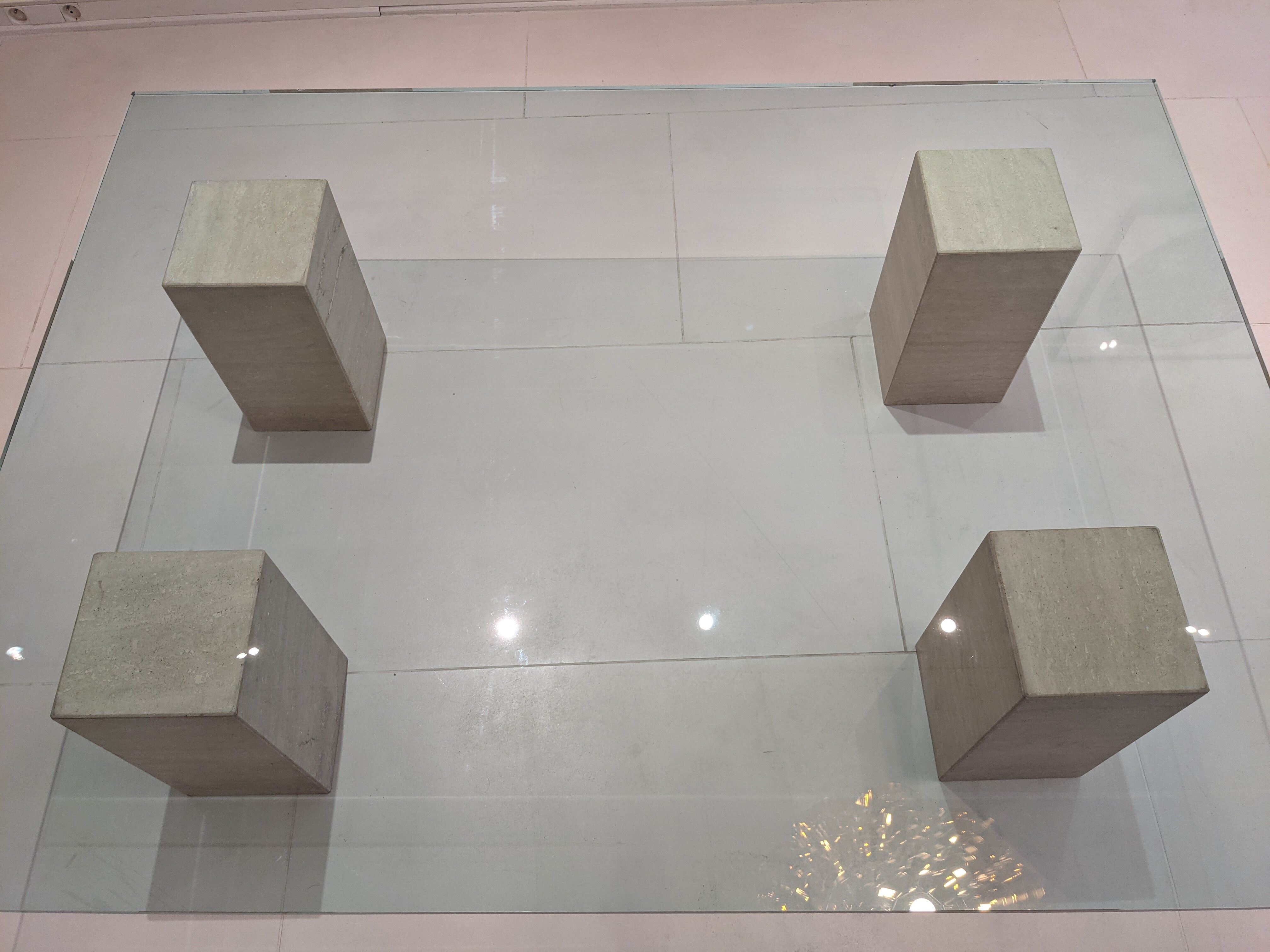 Glass table and travertine feet