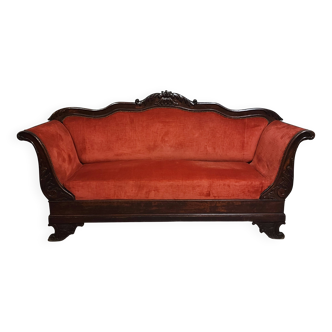 Sleeper or bench from the Charles X period in richly carved mahogany.