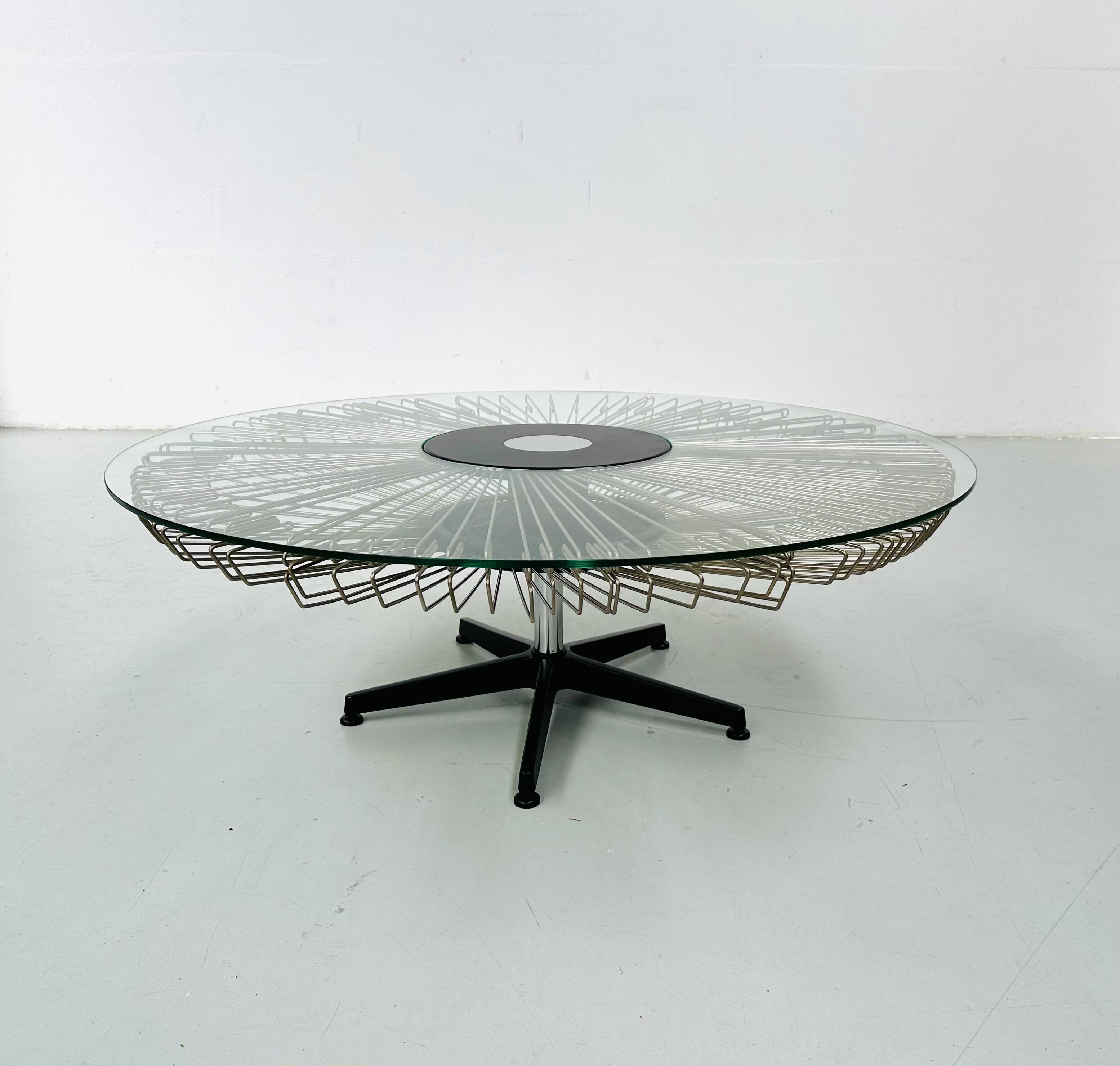 Italian rotating glass and metal coffee table designed for Prada, 1990s.