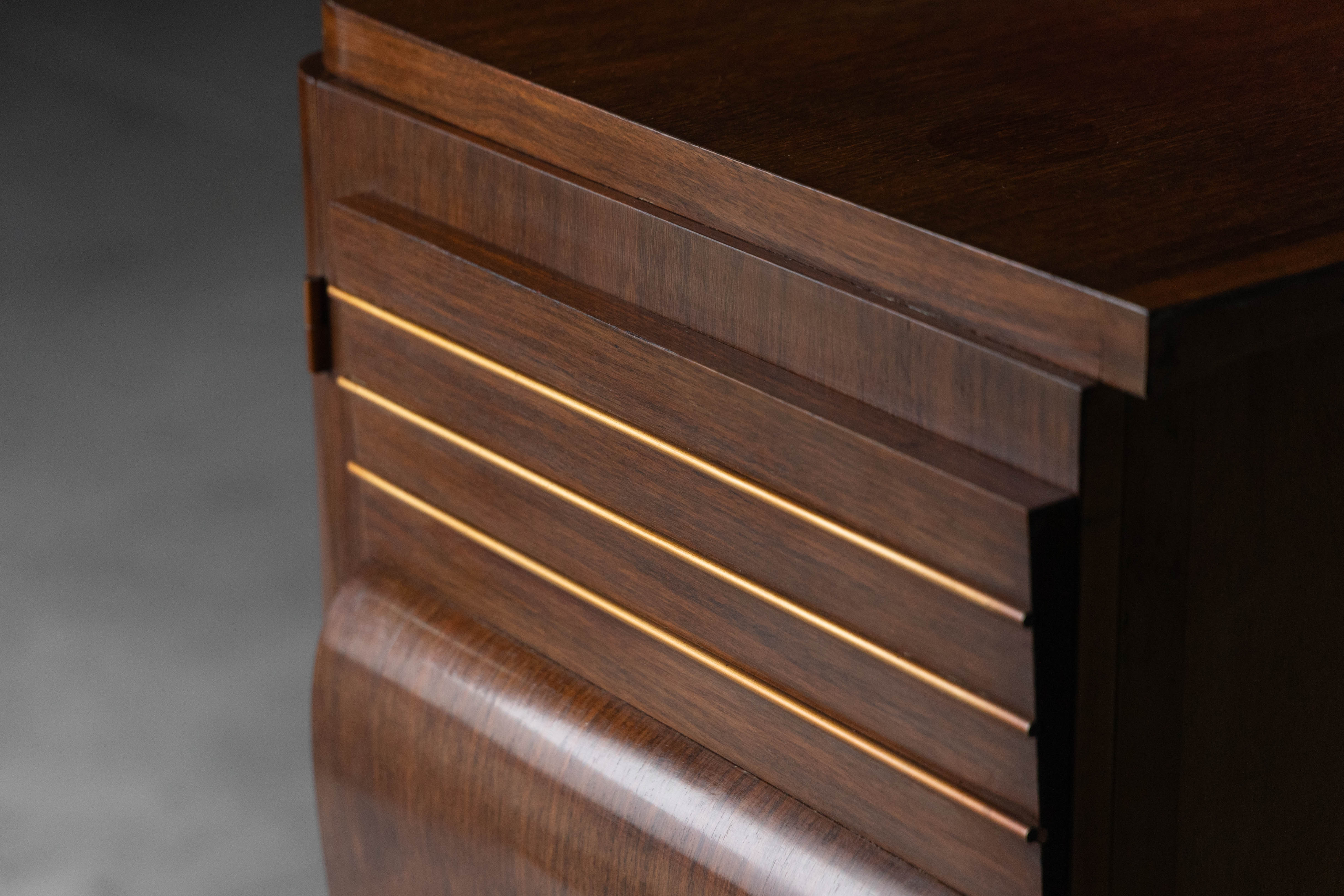 Art Deco walnut sideboard with brass details and sculptural base, France, 1930s