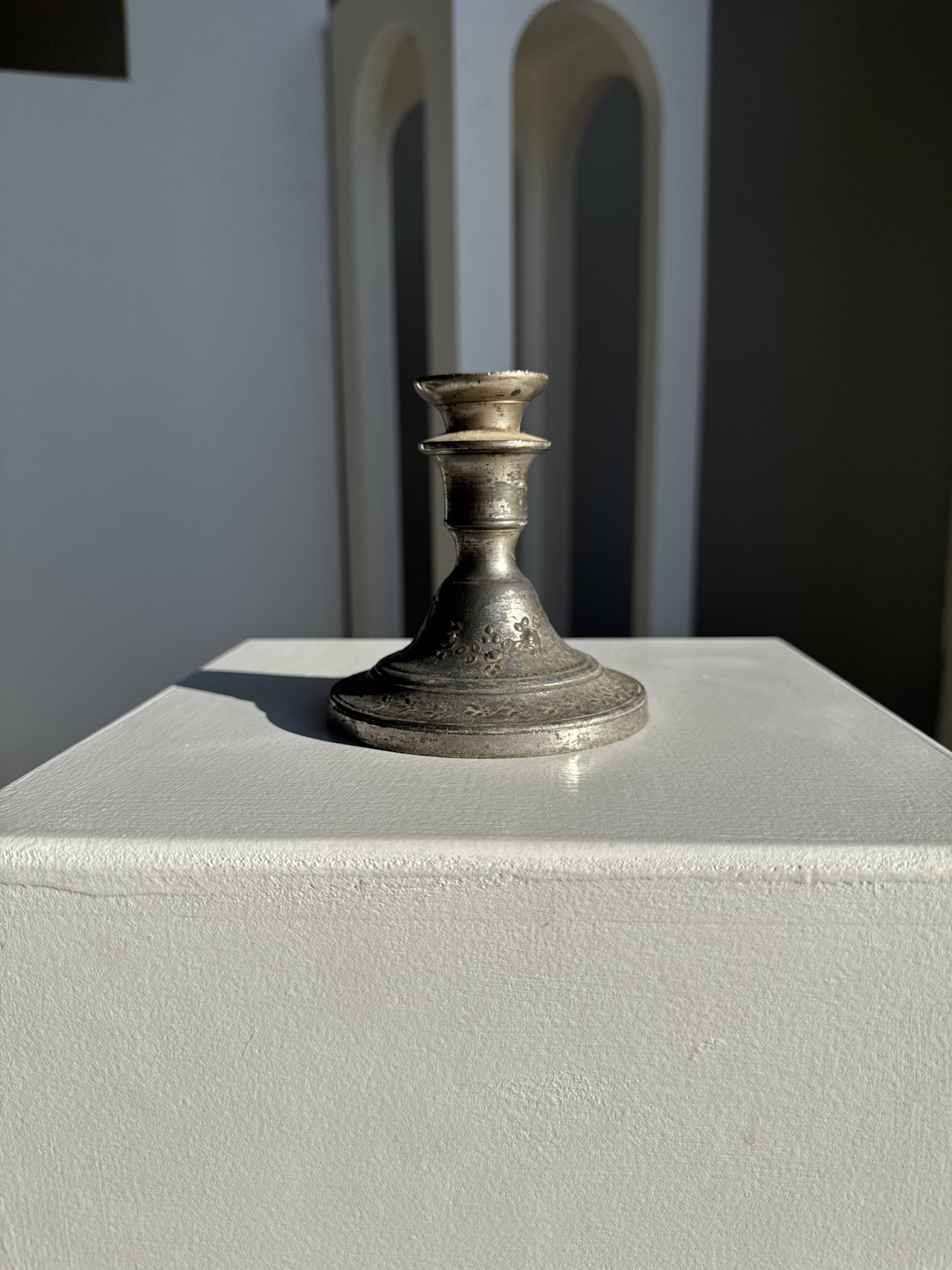 Small antique candle holder engraved in silver-plated metal, in its original condition.
