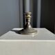 Small antique candle holder engraved in silver-plated metal, in its original condition.