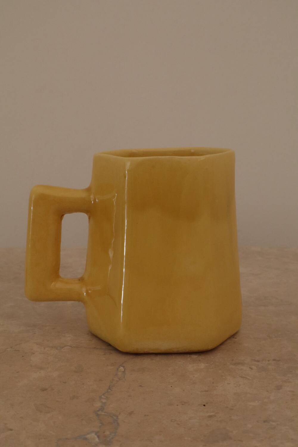 Set of two designer lemon yellow ceramic mugs