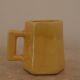 Set of two designer lemon yellow ceramic mugs