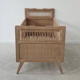 Children's bed in wood and sandblasted rattan from the 1960s.