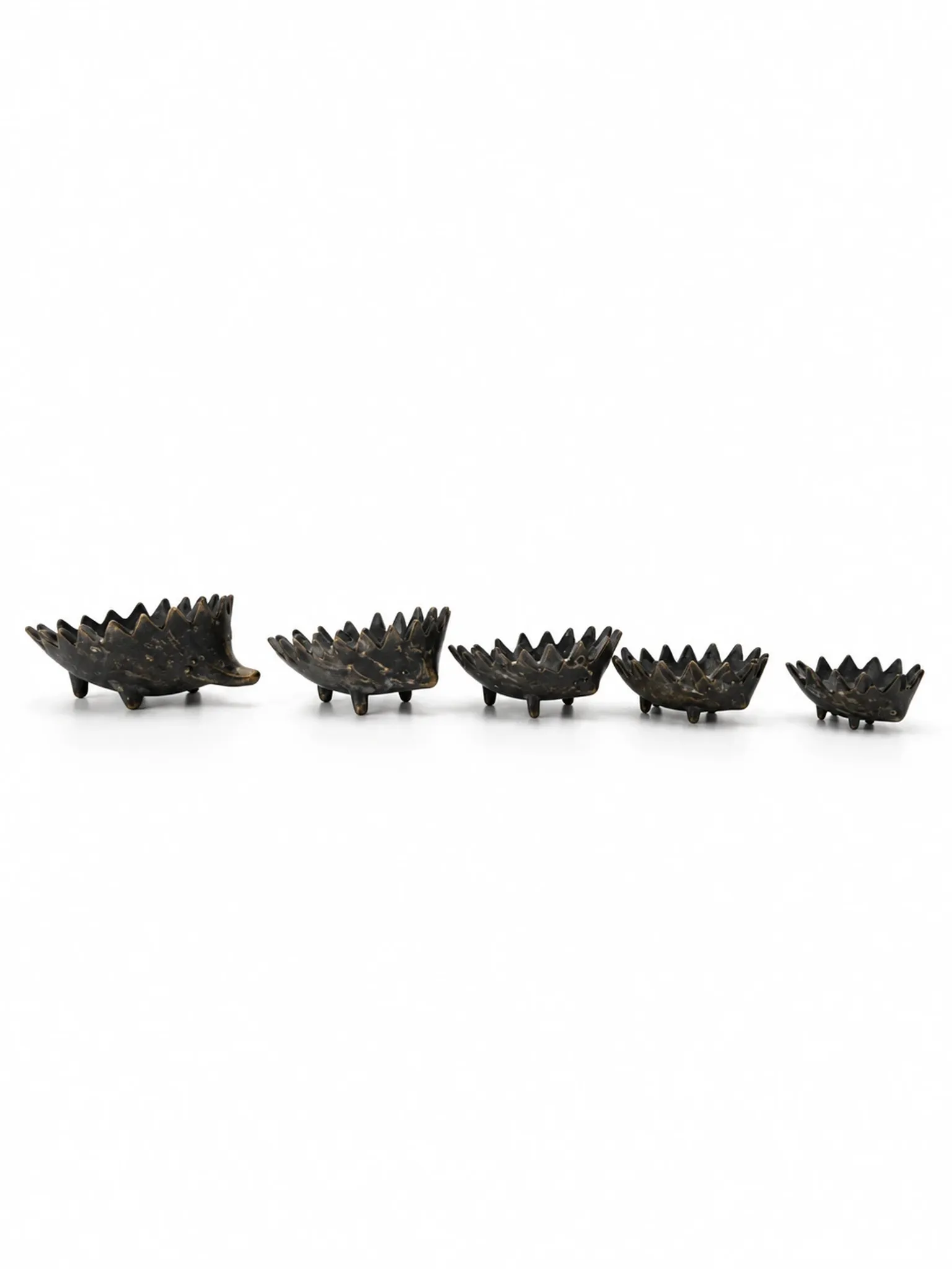 Nested hedgehogs in patinated brass – Walter Bosse