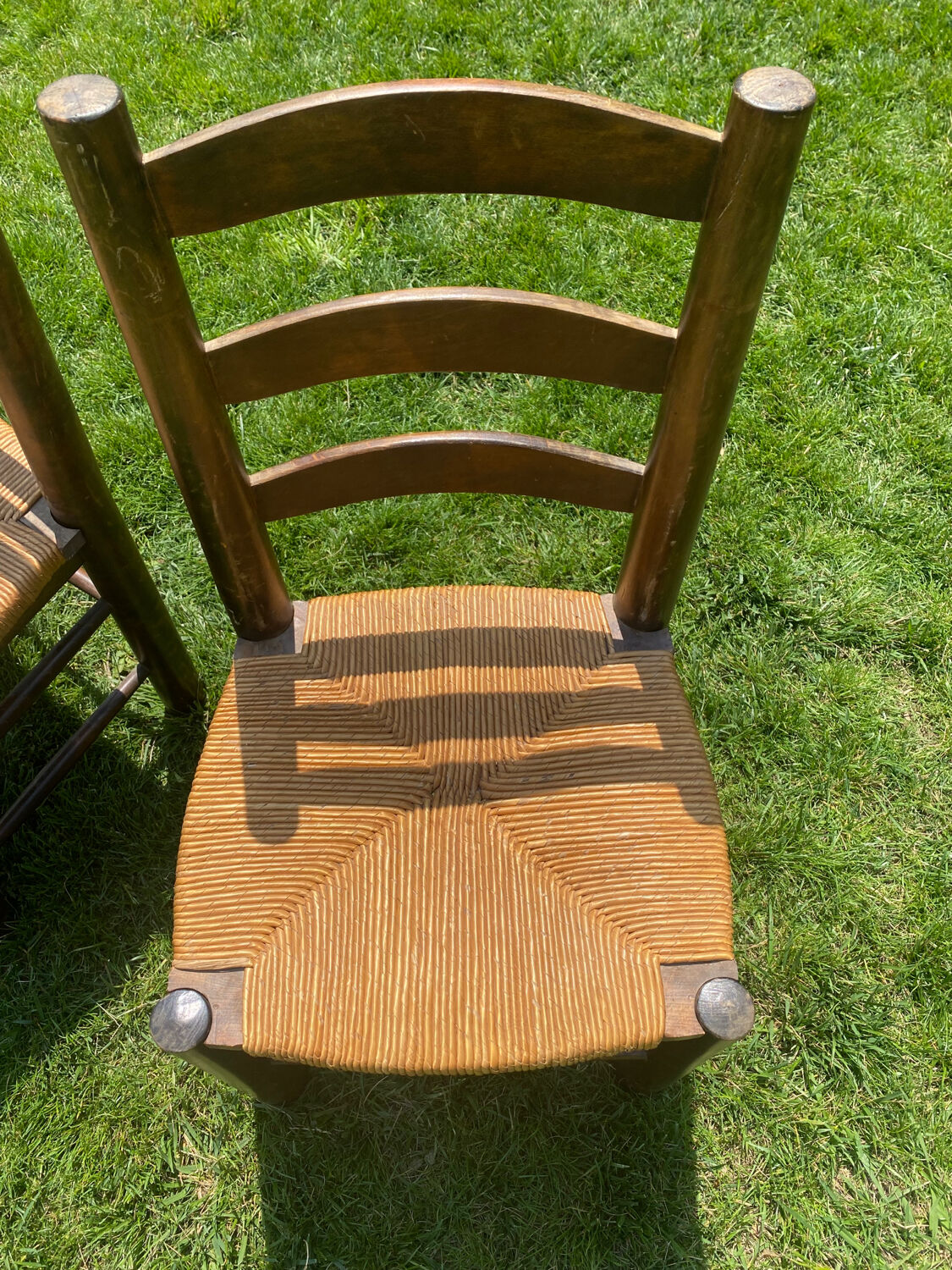 Pair of Georges Robert straw chairs
