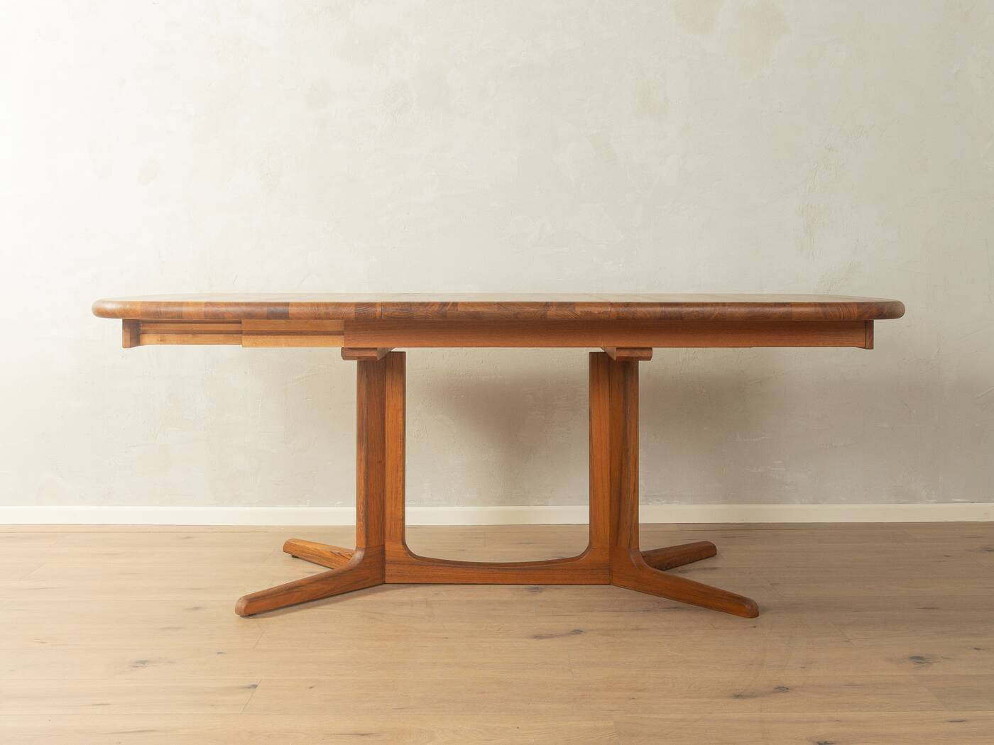 Glostrup dining table, 1980s, solid teak, by Johs. Kristoffersen & Søn, with two extension leaves