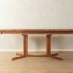 Glostrup dining table, 1980s, solid teak, by Johs. Kristoffersen & Søn, with two extension leaves
