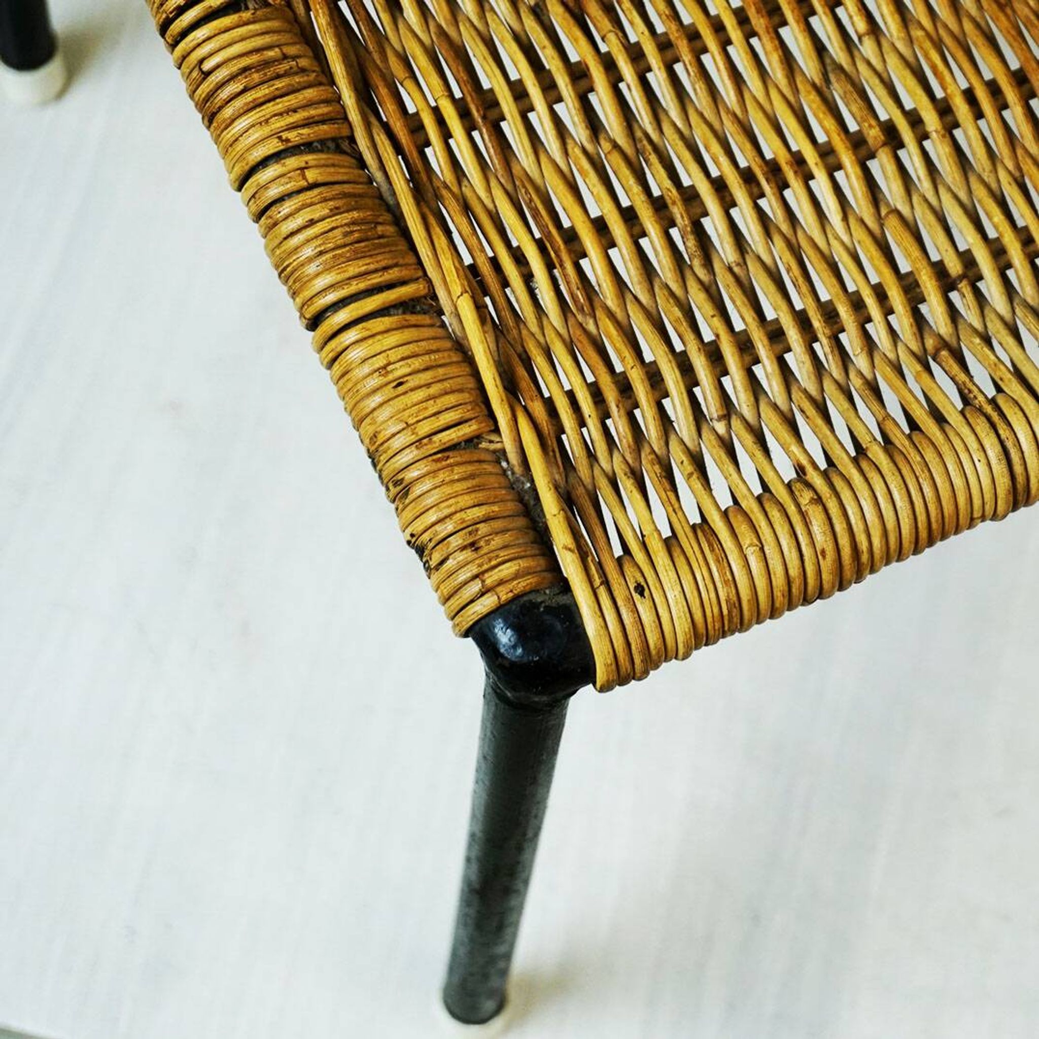 Black steel and wicker side table by Carl Auböck, mid-century.