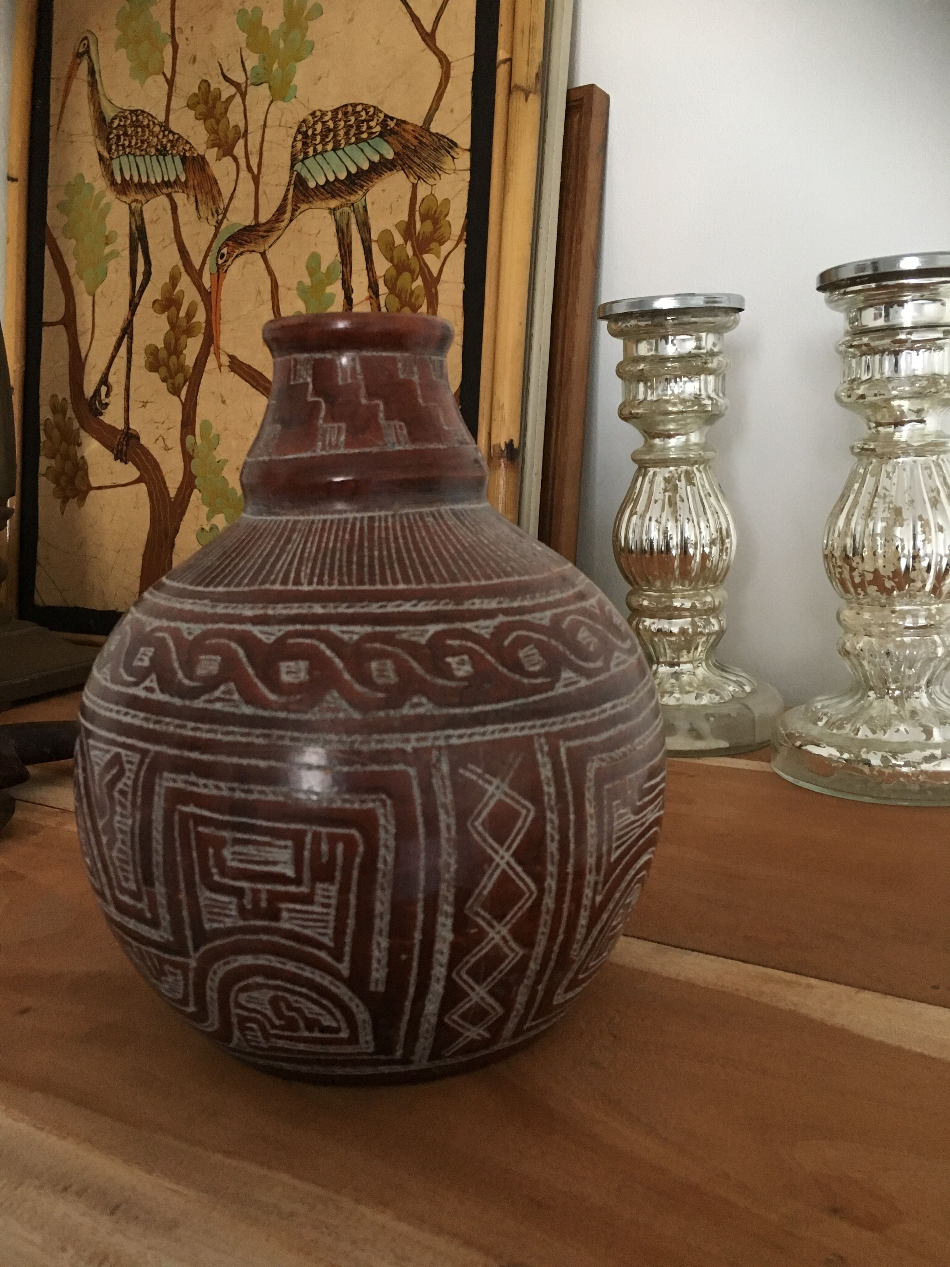 Vase in earth baked ethnic graphic patterns
