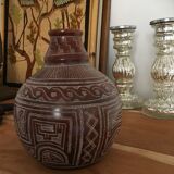 Vase in earth baked ethnic graphic patterns