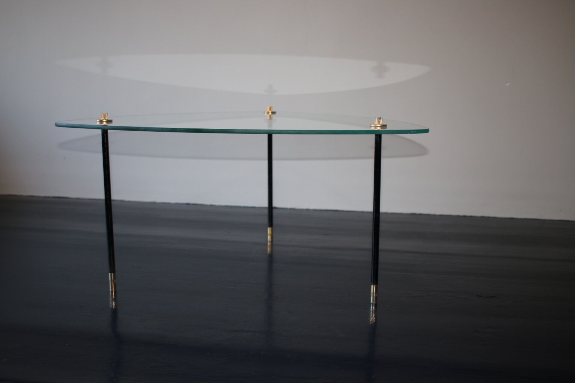 Vintage glass and black-painted brass side table
