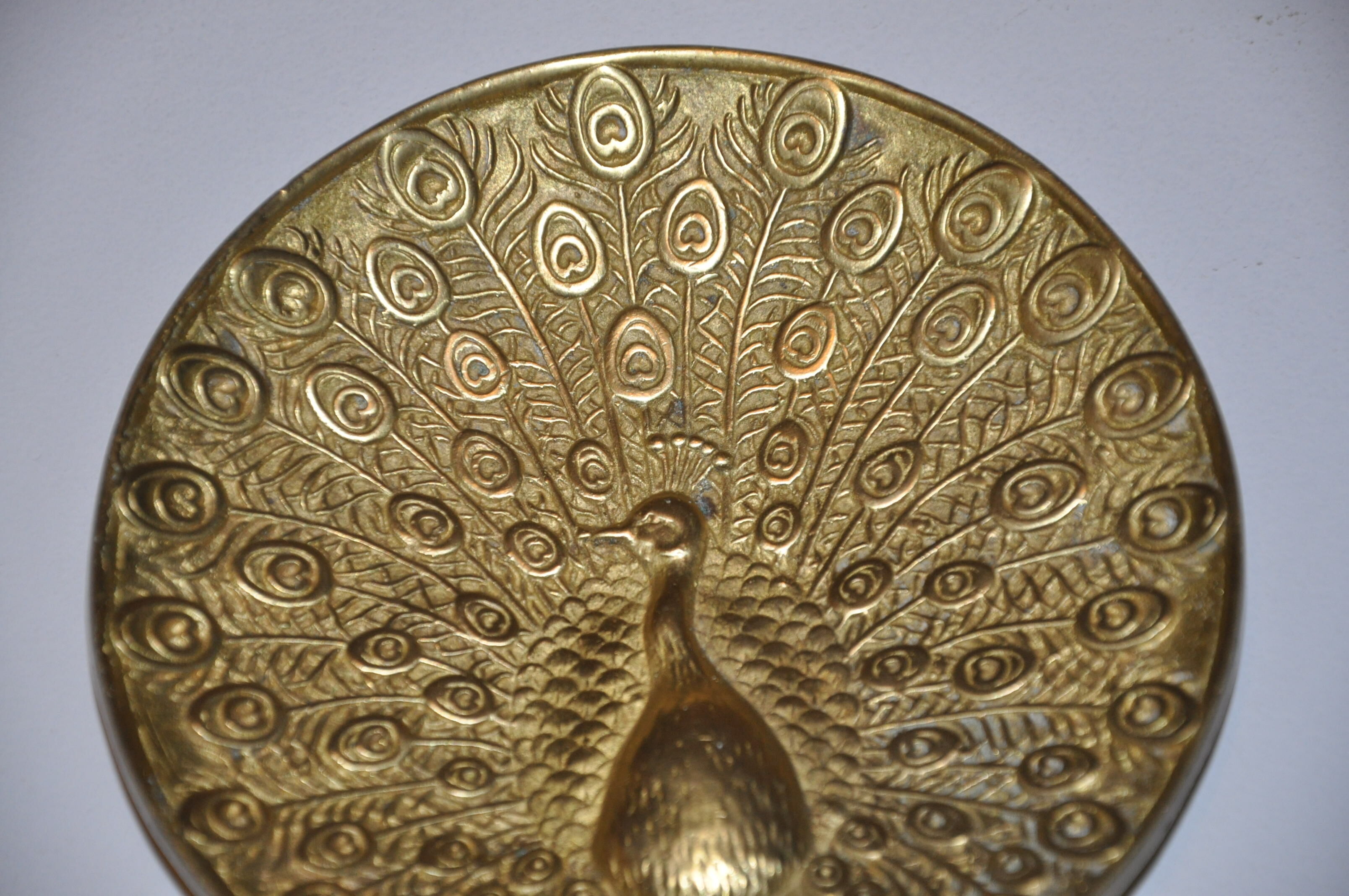 Brass pocket with peacock decoration