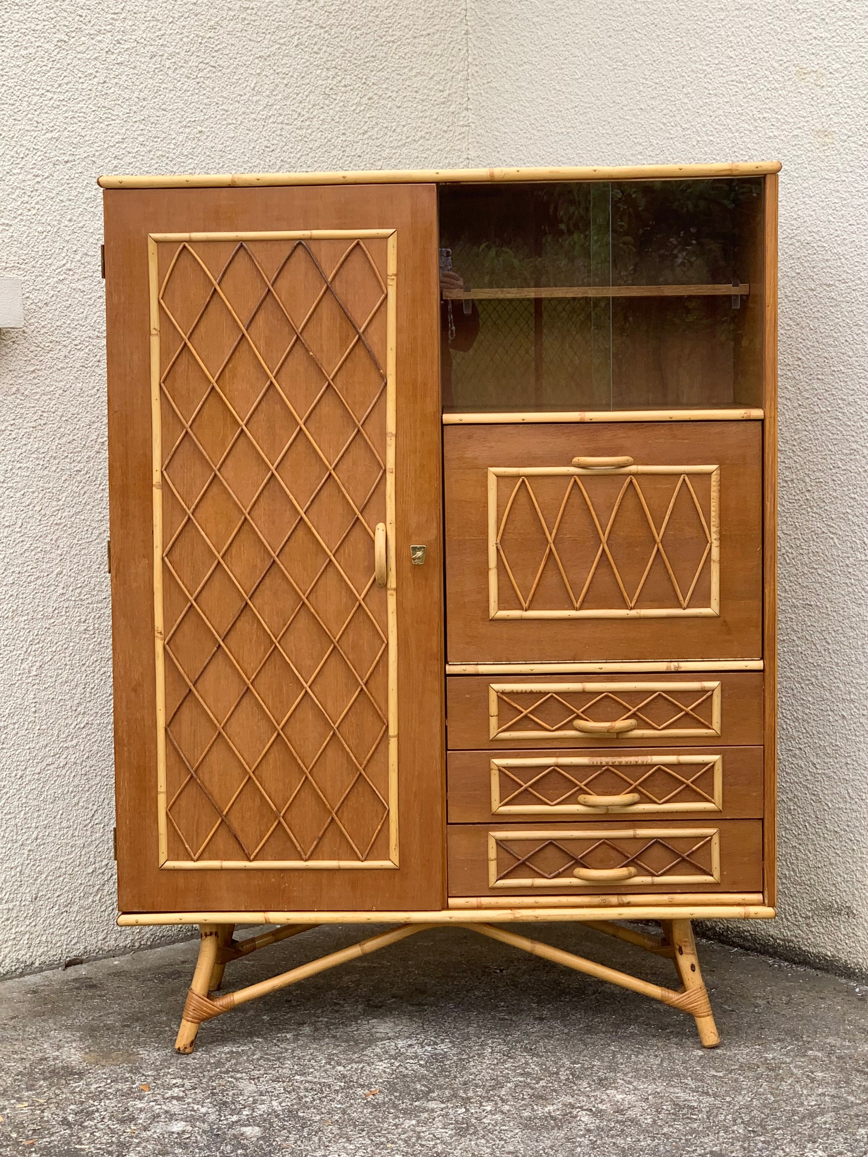 Rattan wardrobe with tapered legs from the 1960s.