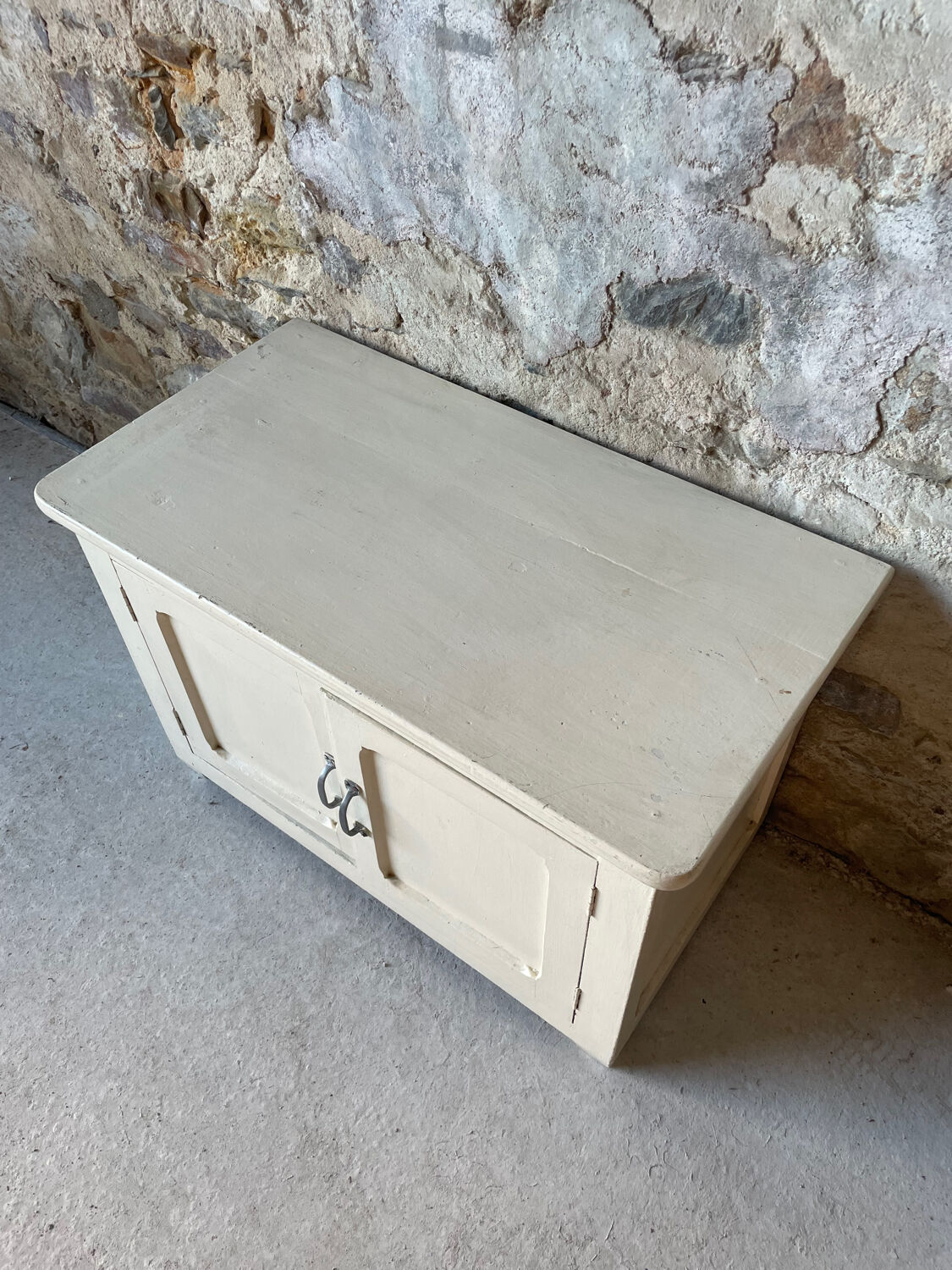 Antique white patinated low cabinet