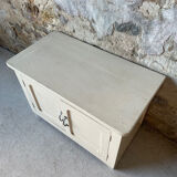 Antique white patinated low cabinet