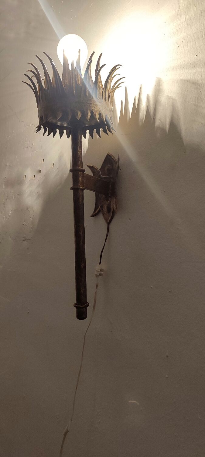 Wrought iron and gold leaf wall light. Spain, 1950s.