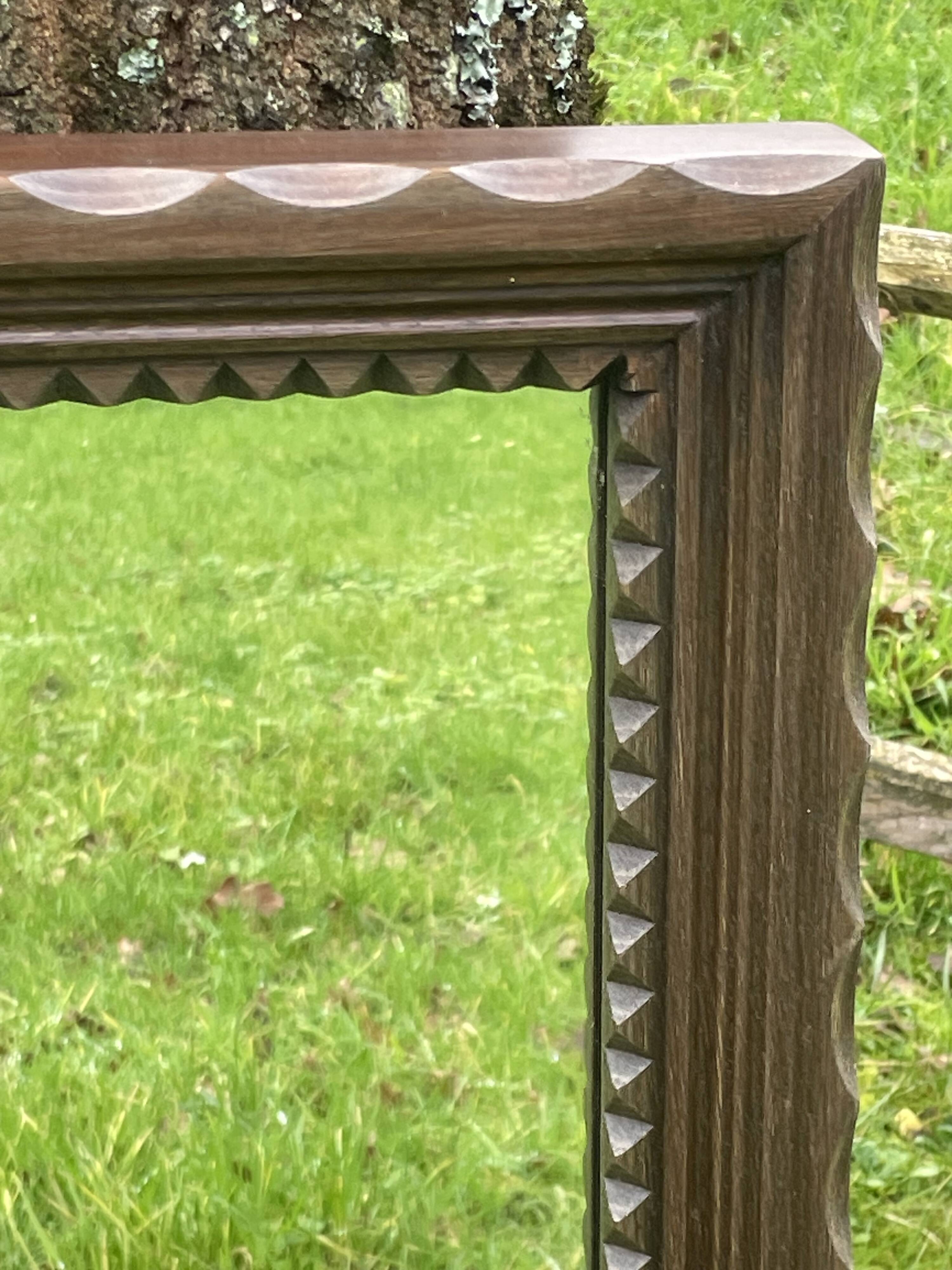 Rustic mirror called brutalist, molded carved natural wood