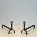 Pair of modernist fire dogs in wrought iron and brass