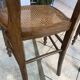 Pair of N2 antique caned and wooden chairs from the 1900s.