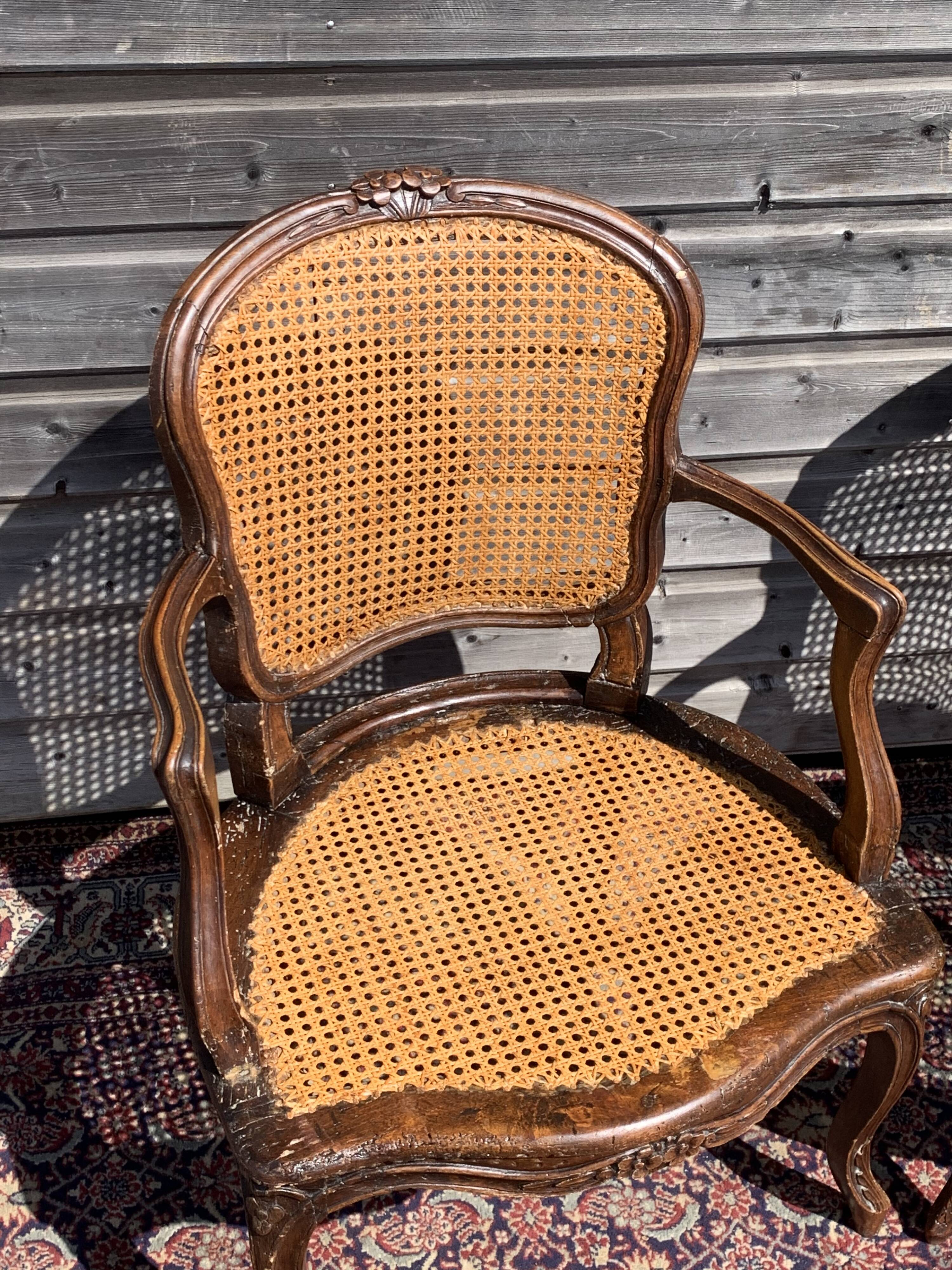 Pair of caned convertible armchairs Louis XV period
