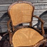 Pair of caned convertible armchairs Louis XV period