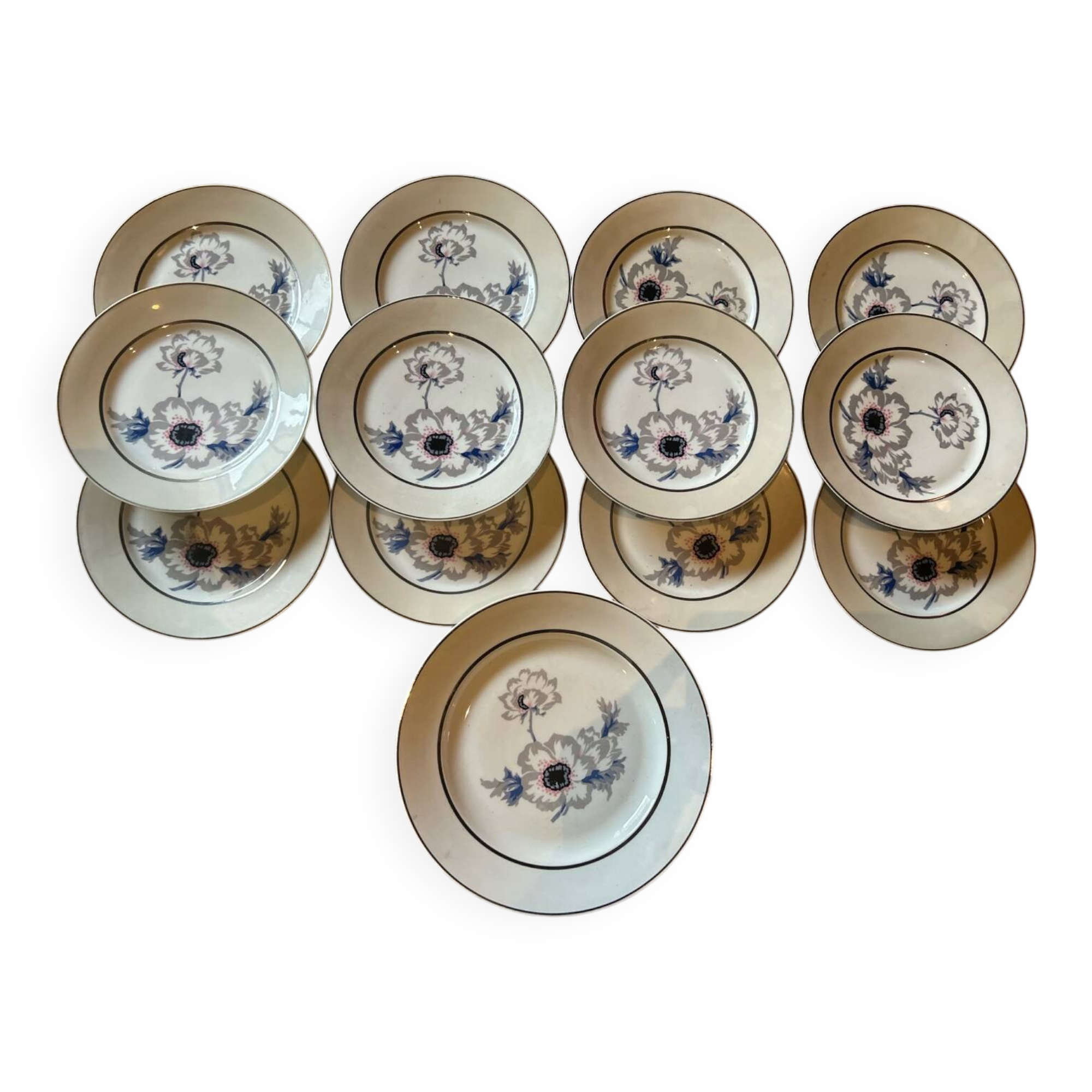 Série de 12 assiettes plates en porcelaine aux anémones